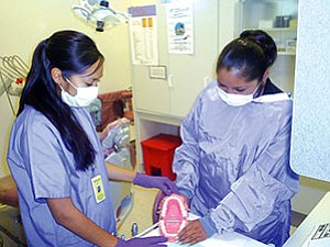 Students Kiara Pahovama and Donnieva Lomatska learn about dental care (Photo courtesy of Hopi Health Care Center).