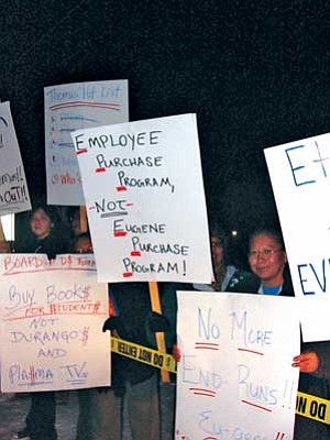 Some of the protesters and their messages to Tuba City Unified School District (TCUSD) Superintendent Eugene Thomas and the TCUSD Governing Board. Thirty to forty individuals braved the cold after the Jan. 9 Governing Board meeting to chant their demands (Photo by S.J. Wilson/NHO).