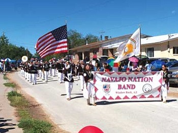 The Navajo Nation Band marches by parade spectators during the 2007 Zuni Tribal Fair parade in Zuni, N.M. (Photo by Wells Mahkee Jr./NHO).