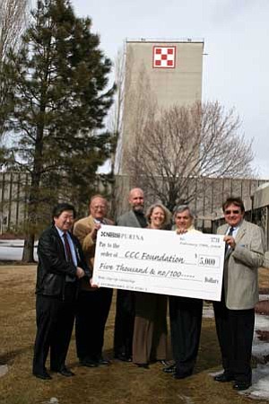 Nestle Purina stepped in with a giant check for the Coconino Community College Step Up Scholarship. From left to right are: Coconino County Juvenile Court Director Bryon Matsuda, CCC Foundation Director Robert Erb, CCC Foundation President Chris Bavasi, CCC President Leah L. Bornstein, Nestle Purina Plant Manager Bill Calloway and Flagstaff Mayor Joe Donaldson.