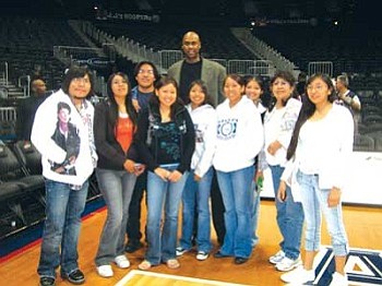 Atlanta Hawks Assistant Coach Alton Lister poses with the Hopi High radio students (Photo by Stan Bindell/NHO).
