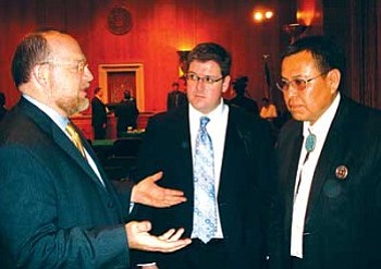 Raymond Maxx (right) confers with Simon Boyce and Gregory Smith (Photo courtesy of NNWO).