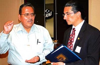 <i>Courtesy photo</i><br>
Charles Long (left), Legislative Staff Assistant for the Office of the Speaker of the Navajo Nation gestures as he speaks with New Mexico Indian Affairs Secretary Alvin Warren at the 2008 Tribal Policy Forum held in early June.