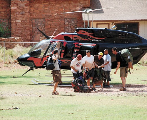 <i>Photo by Joel Masson</i><br>
Victims of the recent floods in Supai Canyon prepare to be evacuated from Supai Village Aug. 17. Williams resident Joel Masson spent a harrowing night in the canyon, but managed to flee the floods unharmed. Additional photos can be seen at grandcanyonnews.com.
