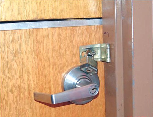 <i>Photo by A. Vann/Dilkon Police District</i>
<br>
A heavy-duty padlock on the door of the Birdsprings Chapter offices puzzled many chapter members and officials this past week. Chapter President Eddie Kee Yazzie is reported to have placed the lock on the door along with a note advising that the lock was not to be tampered with.
