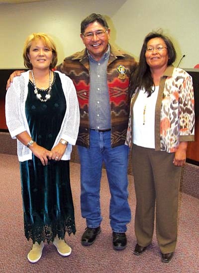 <i>Courtesy photo</i><br>
Retiring Navajo County Supervisor Percy Deal (center) was given a woven jacket as a gift from Constable Esther Grass (left) and Justice of the Peace Suzie Nelson in appreciation for his 28 years with Navajo County on Oct. 20 in Kayenta.