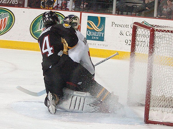 Courtesy Photo by Stew Schrauger<br>
Sundogs # 14, right, Cory Urquhart, takes a shot and scores the first goal of Friday eve’s game with the Amarillo Gorillas.