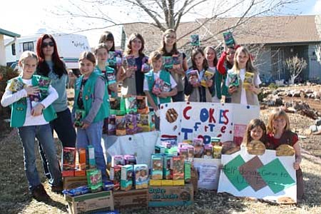 Girl Scouts display the cookies just before packing them for shipping.<br>
Courtesy Photo