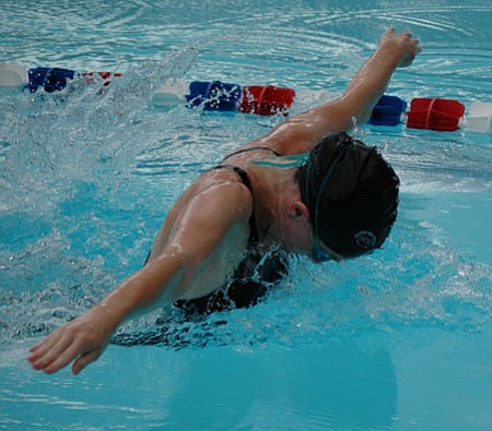 Leandra Mardone shows good form in the 100-meter butterfly at Bradshaw Mountain's first home swim meet of 2009.<br>
TribPhoto/Cheryl Hartz