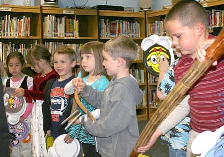 Kindergarten students at Coyote Springs Elementary School demonstrate to school board members what they learned in their music program in December 2009.<br>
Trib File Photo/Sue Tone