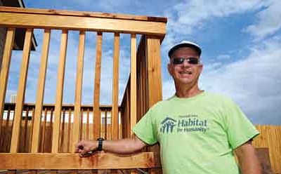 Marty Grossman, volunteer with Habitat for Humanity, helped construct this house in Chino Valley. The volunteers were putting final touches on landscaping this past Thursday.<br>
Photo courtesy of Brett Soldwedel