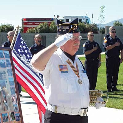 Second Assistant Bugler John Stevens of the American Legion Ernest A. Love Post 6 Color Guard of Prescott salutes during the 9-11 commemorative ceremony at the Prescott Valley Civic Center on Saturday.<br>
Trib Photo/Cheryl Hartz