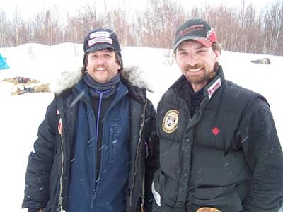 Prescott Valley veterinarian Michael Walker and four-time Iditarod winner Lance Mackey in a checkpoint. <br>Photo courtesy Michael Walker