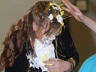 Glassford Hill Middle School teacher Cheryl Taylor gets pied and egged after her class lost the “Penny War” against Jackie Kemsley’s class. The money raised went to the Leukemia and Lymphoma Society.<br>
Photos courtesy Les Stukenberg