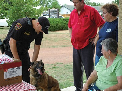 Prescott Valley K9 Officer Paul Hines and the now retired “Joey” meet with area residents at Sunset Park during National Night Out 2009.<br>
FilePhoto/Cheryl Hartz