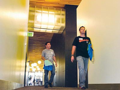 Jeffrey Liu and Alexander Maynard walk down the hallway as they attend the orientation for new students at NAU/Yavapai Campus in Prescott Valley Monday afternoon.<br>
Photo courtesy Les Stukenberg