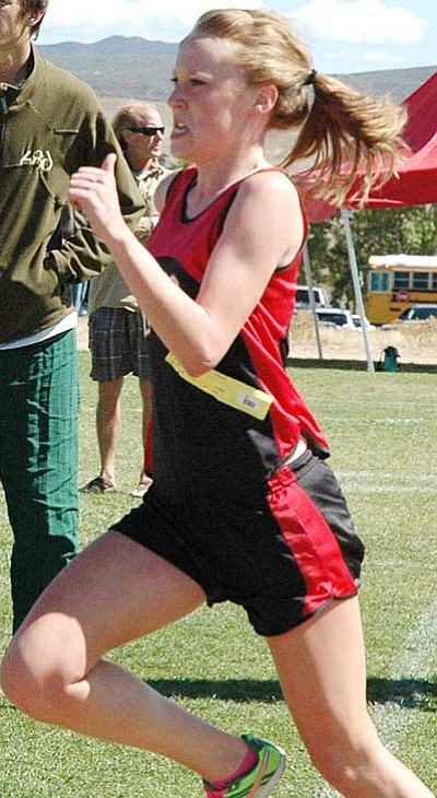 Trib Photo/Cheryl Hartz<br /><br /><!-- 1upcrlf2 -->Bradshaw Mountain’s Kayla Heglund sprints for the finish line after a 3.1-mile race during the school’s annual cross country invitational Saturday.