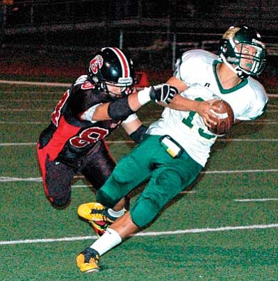 Andrew Bogdanov executes a tackle against a Mohave player during Bradshaw’s Homecoming game. This past Friday at Barry Goldwater High, the Bears’ defensive tackle and kicker recorded 7 first hits and an assist, including 2.5 sacks, to cause more than 26 yards in lost yardage for the Bulldogs. He also kicked three field goals and 3 PATs.<br>
Trib Photo/Cheryl Hartz