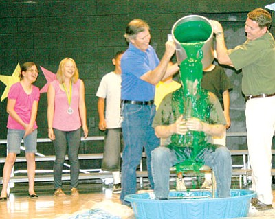 The students read more than 23,000 books, surpassing their goal, and earning 54,000 points total by the end of the year. When this happened, David Boone, Title 1 teacher, agreed to being “slimed” by students.<br>
Trib Photo/Sue Tone