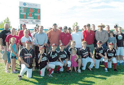 A group of Prescott Valley Little League fans, ball players,
parents and sponsors gathered Sunday afternoon to see the new scoreboards at Mountain Valley Park in Prescott Valey illuminated for the first time.<br>
Trib Photo/Cheryl Hartz