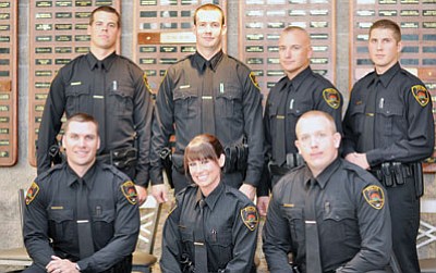 Front row from left, new officers Scott Rudolph, Jennifer Kempf and Shane Flynn, and back row from left, Wesley Dykeman, Marshall Field, Brian Hohrein and Matthew Cahill pose for a photo before NARTA grad ceremonies Thursday.<br>
TribPhoto/Heidi Dahms Foster