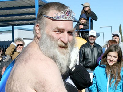 Michael Olhausen, Prescott Valley, takes first place Saturday in the Ice Princess contest for hairiest-chested man, winning a grill from Ace Hardware, a tiara and sash. Olhausen reigns until next year’s annual Polar Bear Splash.<br>
Trib Photo/Sue Tone