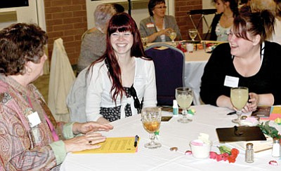 UUAW member Sandra Bennett, left, converses with two Bradshaw Mountain High School students, Samantha Hudson, middle, and Tawnya Shy, during the annual Sister-to-Sister luncheon on Feb. 5.<br>
Courtesy Photo