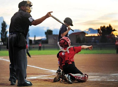 Umpire Jeff Cook works the plate during the District 10 Majors All-Star Tournament in Chino Valley two weeks ago.<br>
Daily Courier Les Stukenberg/Courtesy