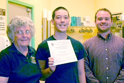 The Club honored Kevin Long, middle, from Glassford Hill Middle School with his eighth-grade math teacher, John Colgan, right.<br>
Courtesy photo