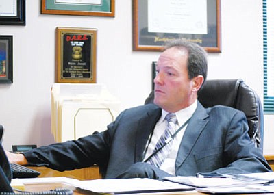 The Prescott Valley Police Department’s new chief, Bryan Jarrell, reviews reports to become more familiar with his staff and procedures.<br>
Trib Photo/Briana Lonas