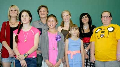 Trib Photo/Sue Tone<br>
Winners of the Professional Writers of Prescott Short Story student writing contest are, from left, Zara Glidden, Sophia Corradi (Liberty Traditional School), Johan Glidden, Hannah Lennon (Humboldt Elementary School), Glory Glidden, Serene Aviles, Ivy Broiles, and Gabby Duchesne. Not pictured is Abby Nelson.