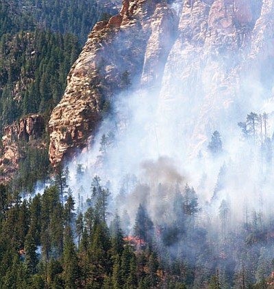 More than 500 people were on the ground Wednesday fighting the Slide fire near Sedona.<br>
AP Photo
