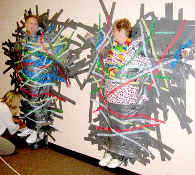 Turrill students tape principal, teachers to wall in fundraiser for new  books - Lapeer Area View