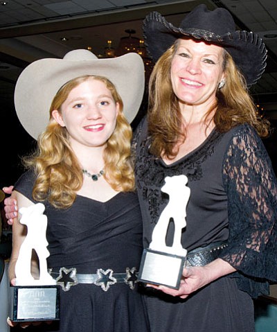 Kristyn Harris, 19, left, from Texas,with Susie Knight, from Colorado, when Harris received the Academy of Western Artists Awards for Best Female Performer and best Female Cowboy Poet of the Year in March. Knight performs Friday night and Harris on Saturday at the Blue Rose Heritage and Culture Center in Prescott Valley.<br>
Courtesy Photo