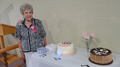 Friends turned out to celebrate Trish Rasmussen’s 85th birthday, which included a buffet and not one but two birthday cakes. (Courtesy photo)