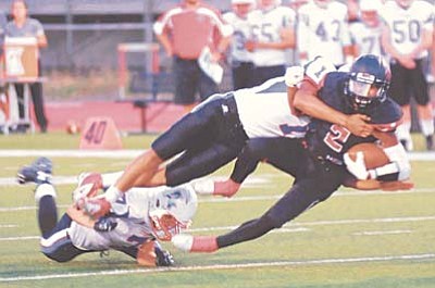 Les Stukenberg/PNI<br /><br /><!-- 1upcrlf2 -->Bradhsaw Mountain’s David Otero gets tackled after a long gain as the Bears take on Arcadia Friday night in their 2015 football season home opener.