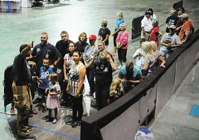 Some of the close to 100 people get final instructions before beginning the 9/11 Memorial Stair Climb at the Prescott Valley Event Center Saturday in honor of the firefighters and police officers who died in the attacks of 9/11. (Photos by Les Stukenberg/The Daily Courier)