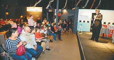 Greg James welcomes guests to the temporary home of the Lonesome Valley Playhouse and Children’s Theater in the Prescott Valley Entetrtainment District Friday night. (Les Stukenberg)
