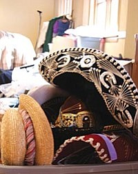 VVN/Raquel Hendrickson<br>
Costumes from Verde Valley Theatre are stacked and stored in the Grand Theater on Main Street in Clarkdale. Plans are to eventually turn the historic building into a performance hall, but for now it is used for VVT storage and workspace.
