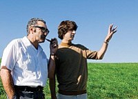 Focus Features<br>
Demetri Martin (right) talks with Eugene Levy about his farmland in Taking Woodstock.