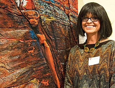 Sharron Vincent Porter with “Time Lines/Ancient Beauty,” one of the paintings she will bring to the University Women of Sedona meeting at 10 a.m. on Monday, Nov 4. Photo by Georgia Michalicek<br /><br /><!-- 1upcrlf2 -->