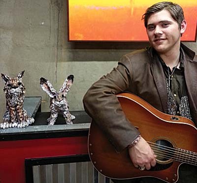 At the New State Motor Company, Patrick Lincoln has vibrant colors of spring on display to compliment new animals hand-formed of clay by Janie Layers. There will be refreshments served and a live performance by Ezra Anderson (pictured).