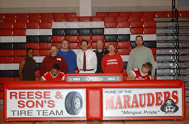 VVN/Wendy Phillippe
Layton Dickerson and Tim Kessel sign their Letters of Intent Wednesday in the MUHS gym accompanied by their parents, coaches Bob Young and Walsworth, Athletic Director Michael Boysen and Principal Marc Cooper
