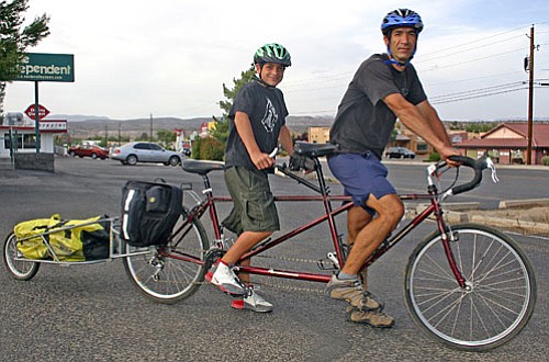 Romano and Domenic Scaturro of Cornville posed with the tandem bicycle they will ride from Washington State to Maine this summer during a nine-week, 4,000-mile trip.