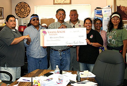 Courtesy photos<br>
Yavapai-Apache tribal members toured the damage a Havasuapai Village and provided  monetary relief.