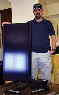 Matt Pullen of Arizona Solar Power shows what a typical solar panel made by Sunpower looks like.