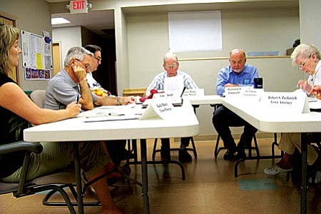 VVN/Jon Hutchinson
Clarkdale Town Council members review documentation that has led town officials to believe Cottonwood's planned annexation of eight square miles of Forest land is not legal.