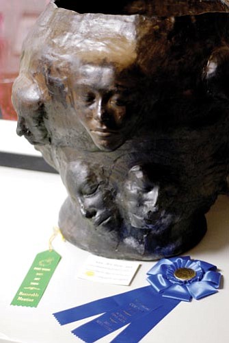 VVN/Jon Pelletier<br>
Sarah Latham's ceramic "Self-Portrait" sits with the award ribbons it received at this year's Yavapai County Fair and Fort Verde Days art contests.