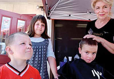 Nancy Siegel is well known for giving free haircuts to children before school started. Nancy enlisted the help of many hair stylists for that event. She later expanded the program to help people looking for work, providing haircuts to men and women. The free makeover for women included makeup. She has helped many people through donations and years of service. For five years, Nancy helped with the food program of the Old Town Mission when Jesse Gamble was director. She also worked for the Children&#65533;s Breakfast at the Assembly of God, under Pastor Peters. Nancy also helped raise money for Relay for Life for three years, and she was a member of the Chamber of Commerce for seven years. She was a contributor to the LightHeart Foundation, which provided gifts and visits to the elderly during Christmas season.