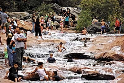 What: Slide Rock State Park<br /><br /><!-- 1upcrlf2 -->Where: Arizona 89, 7 miles north of Sedona or 20 miles south of Flagstaff.<br /><br /><!-- 1upcrlf2 -->When: Open every day except Christmas Day from 8 a.m. to 5 p.m.: until 6 p.m. during summer months.<br /><br /><!-- 1upcrlf2 -->How Much: $20 per car (1-4 adults) from Memorial Day to Labor Day, during other months $10 per car; $3 per individual or bicycle<br /><br /><!-- 1upcrlf2 -->Contact: 282-3034 and www.pr.state.az.us.